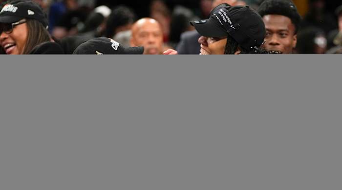 Las Vegas Aces head coach Becky Hammon holds A’ja Wilson’s hand while celebrating their WNBA Finals win over the Liberty.